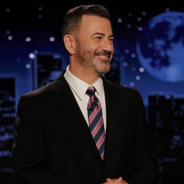 Jimmy Kimmel smiles while delivering a monologue.
