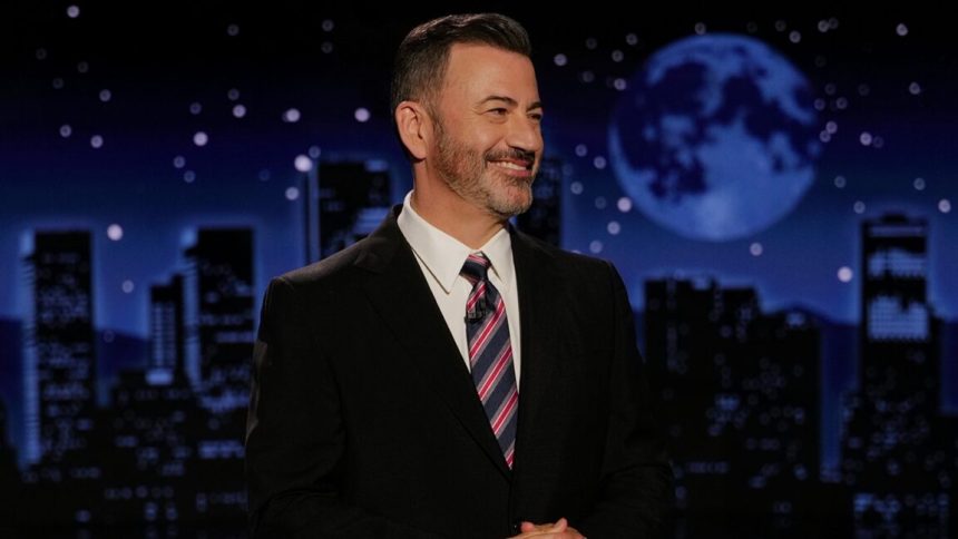 Jimmy Kimmel smiles while delivering a monologue.