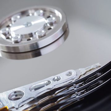Image of silvery disks and small pivoting arms.