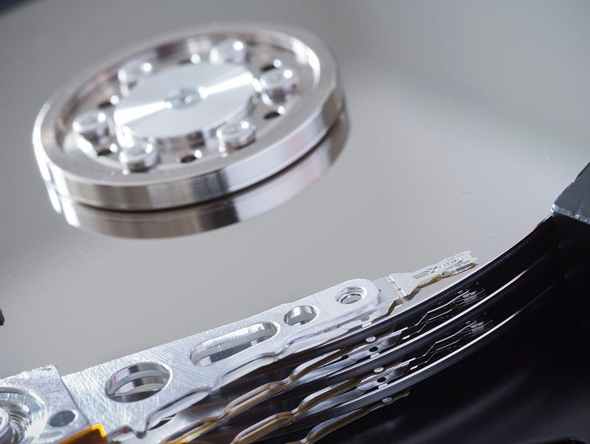 Image of silvery disks and small pivoting arms.