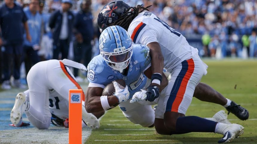 UNC falls short but shows improvement in OT loss to UNC falls short but shows improvement in OT loss to Virginia
