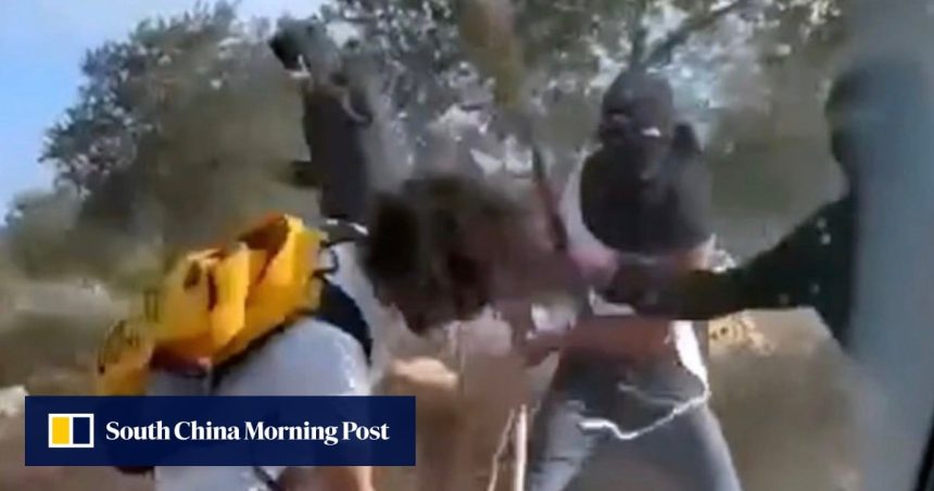 Videos show masked Israeli settlers beating Palestinian olive harvesters in the West Bank