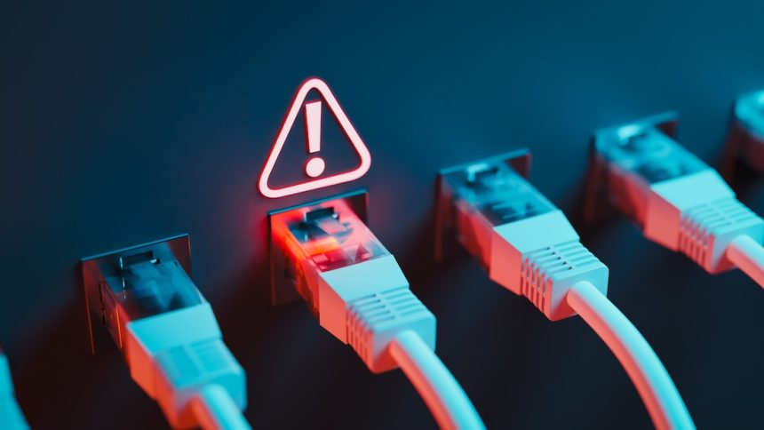 A single point of failure triggered the Amazon outage affecting Ethernet cables accompanies by an exclamation points inside a triangle.