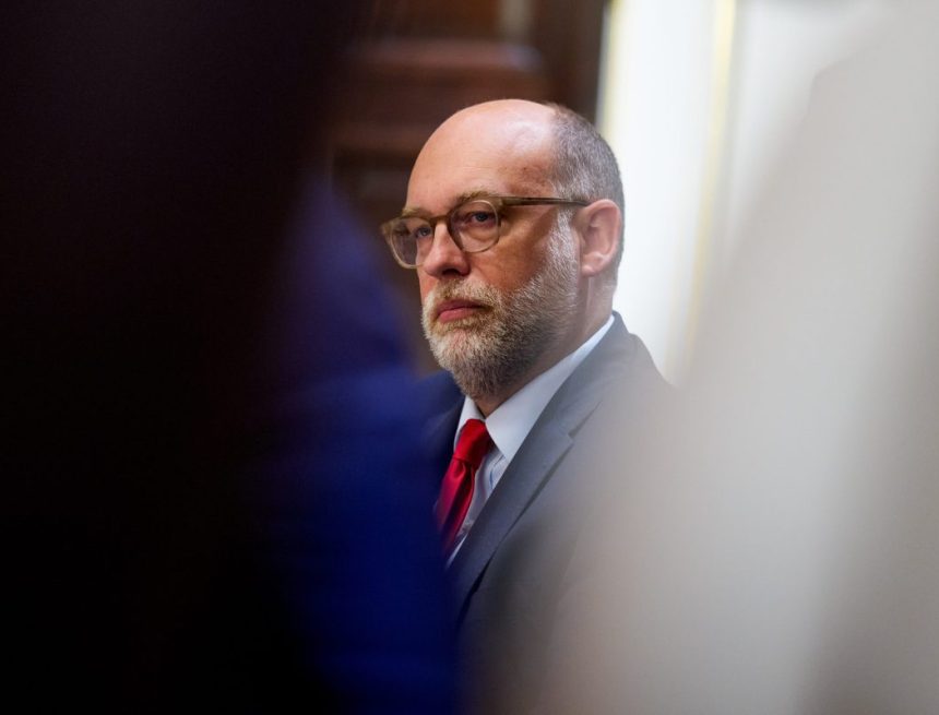 Russell Vought, director of the Office of Management and Budget (OMB), sits in a cabinet meeting.
