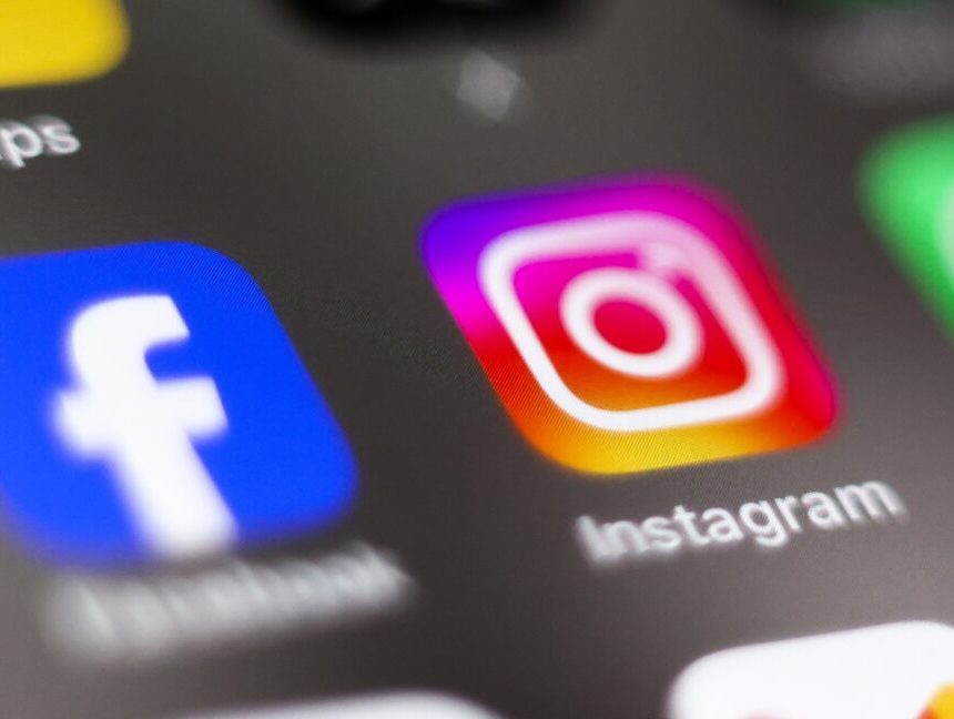 Facebook and Instagram app icons on a phone screen.