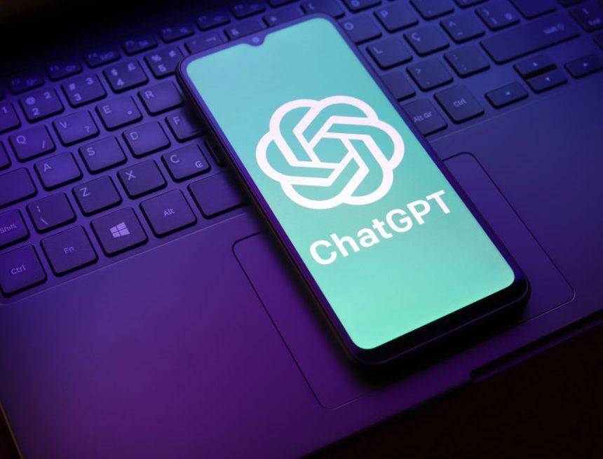 The ChatGPT logo appears on a smartphone screen