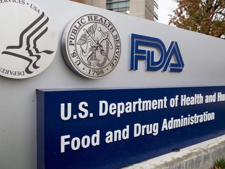 Words and symbols adorn a large outdoor sign.