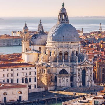 Fashion's Sustainability Journey Unpacked at 2025 Venice Forum Aerial View of the Grand Canal and Basilica Santa Maria della Salute, Venice, Italy. Venice is a popular tourist destination of Europe. Venice, Italy.