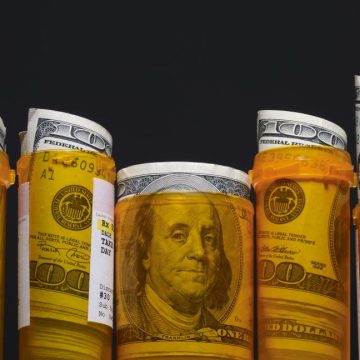 Hundred dollar bills inside prescription pill bottles