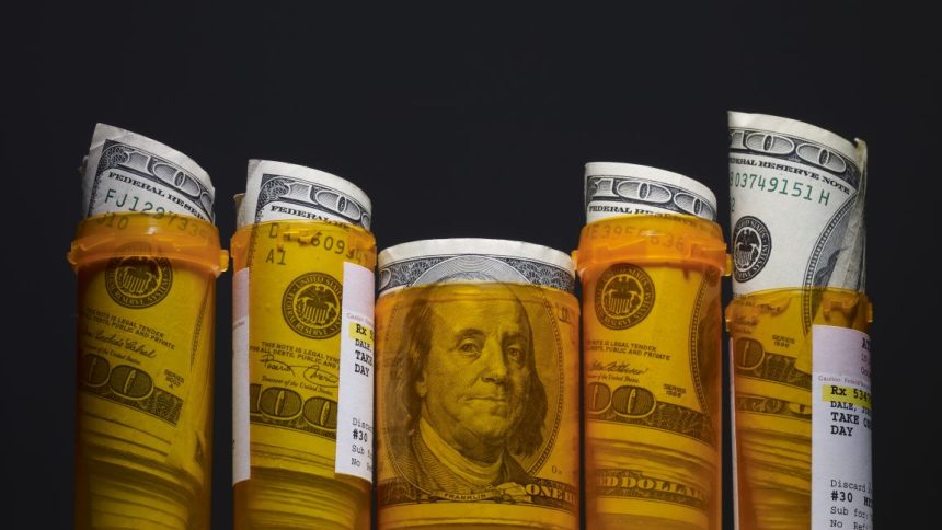 Hundred dollar bills inside prescription pill bottles