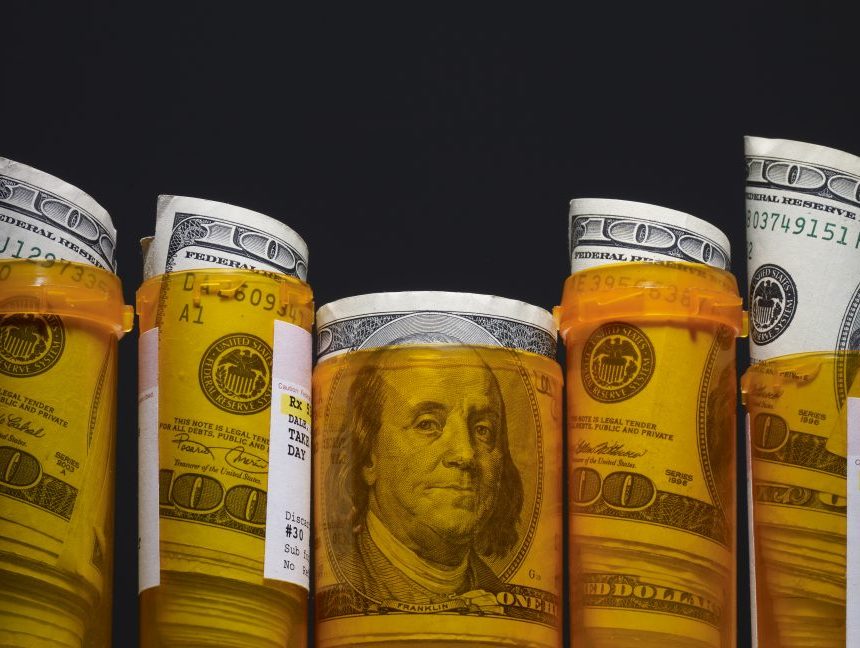 Hundred dollar bills inside prescription pill bottles