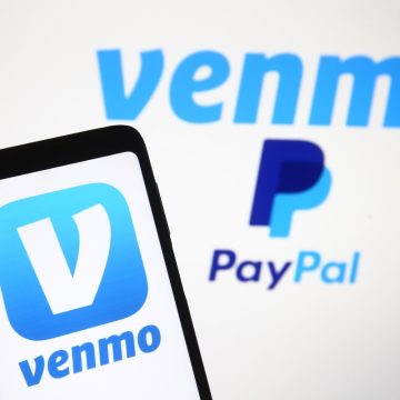 PayPal partners with OpenAI to let users pay for their Venmo logo, a mobile payment service of PayPal is seen displayed on a smartphone and a PC screen.