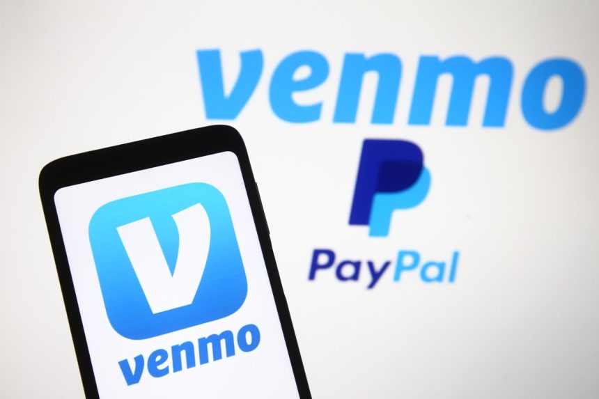 PayPal partners with OpenAI to let users pay for their Venmo logo, a mobile payment service of PayPal is seen displayed on a smartphone and a PC screen.