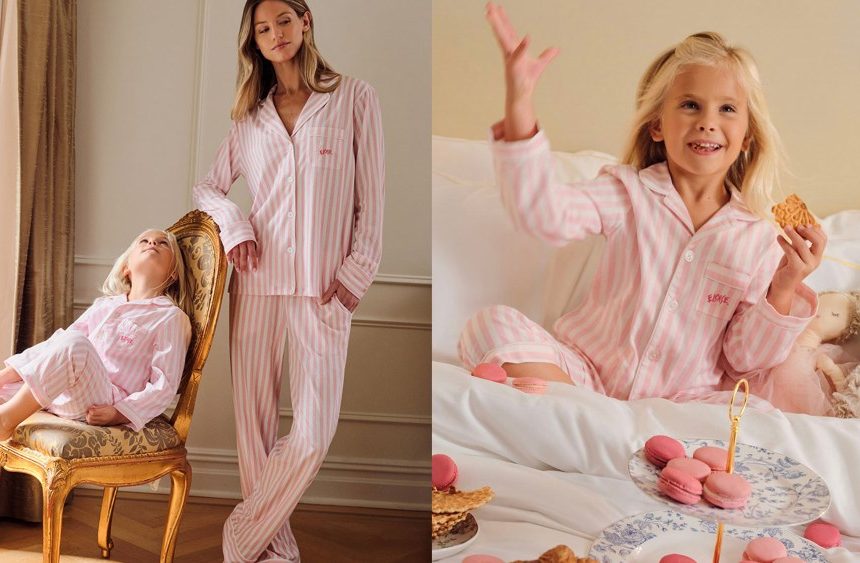 woman and girl wearing matching striped pajamas; girl sitting in bed while eating sweet treats and wearing said pajamas