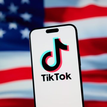 Trump and Xi will ‘consummate’ TikTok deal on Thursday, treasury The TikTok app and logo are seen on a mobile device in front of a US flag