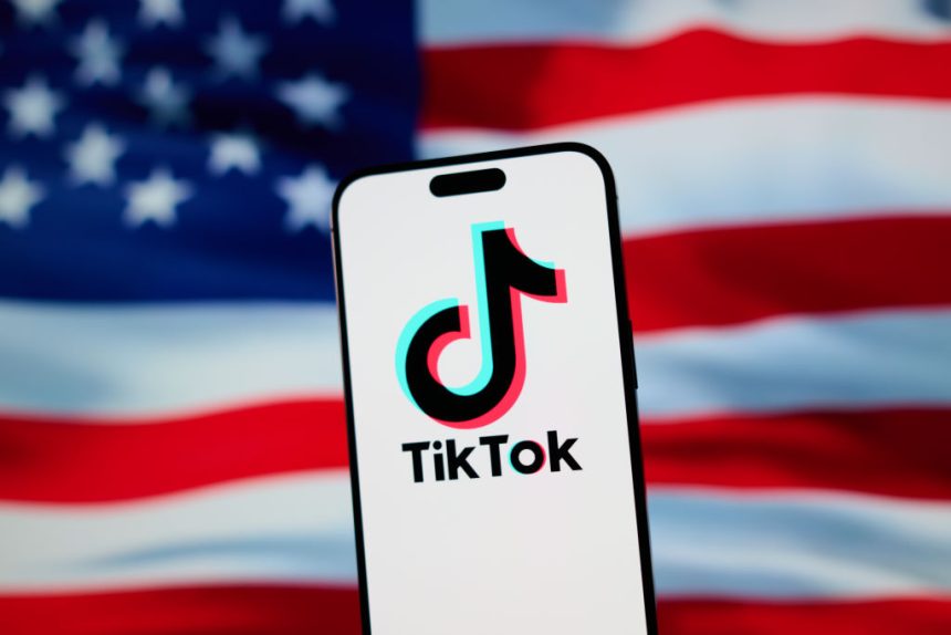 Trump and Xi will ‘consummate’ TikTok deal on Thursday, treasury The TikTok app and logo are seen on a mobile device in front of a US flag