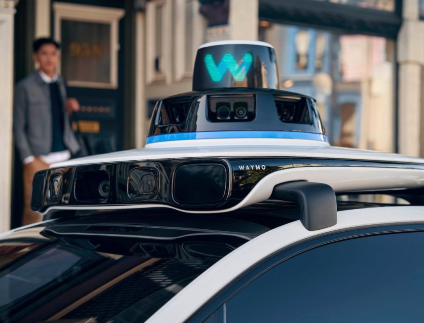 A close up of the rooftop of a Waymo robotaxi that shows sensors.