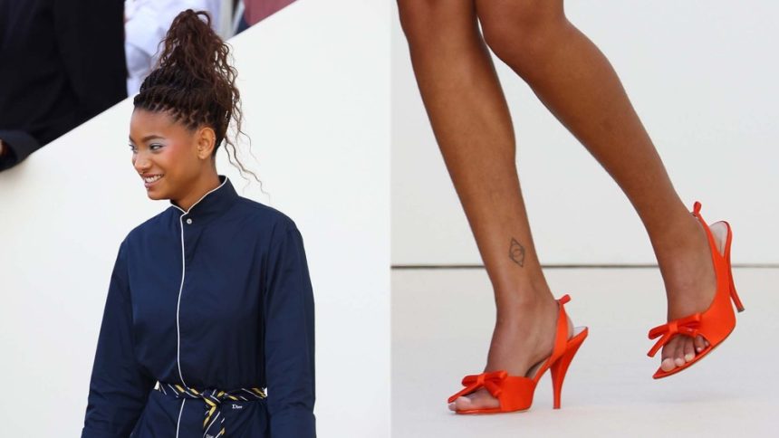 Willow Smith wears vibrant orange slingback pumps with a bow on the vamp at the Christian Dior Womenswear spring 2026 show as part of Paris Fashion Week on Wednesday in Paris.