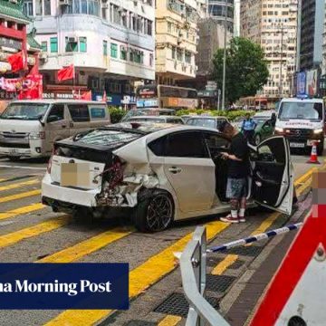 8 people injured when private car veers onto pedestrian island in Hong Kong