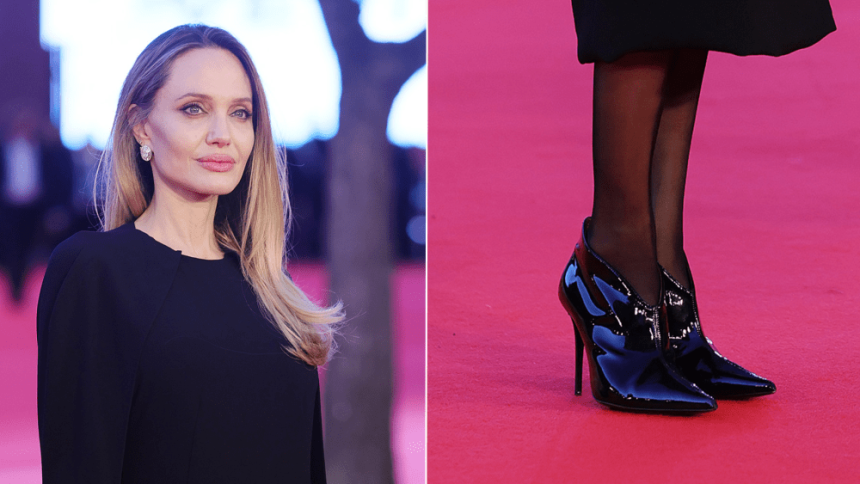 Angelina Jolie wears V-cut patent leather booties at the Rome premiere. of"Couture" on Saturday.