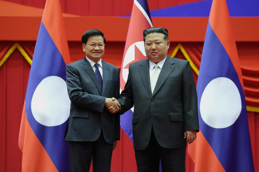 Kim Jong Un meets Laos leader for first summit talks, vowing to boost ties