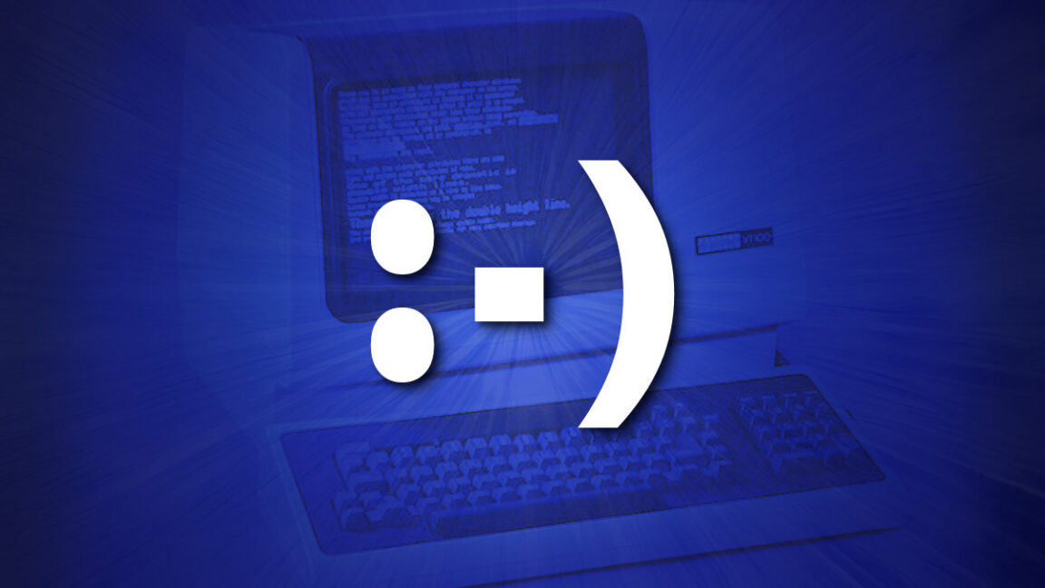 An emoticon on top of a DEC VT-100 terminal in blue.