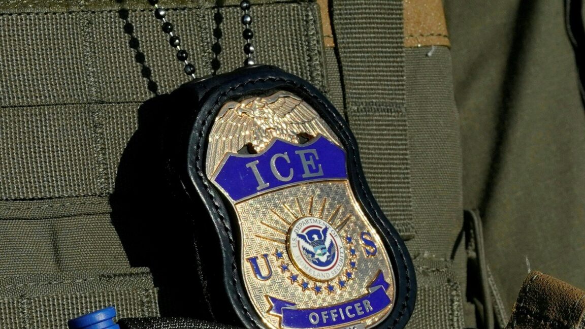 A badge with the words "ICE Officer."