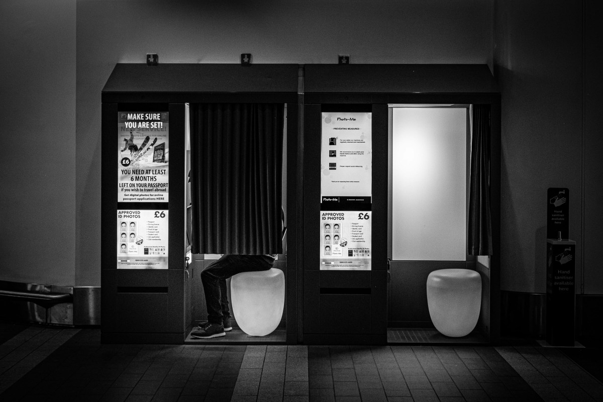 A black and white picture of two photo booths.
