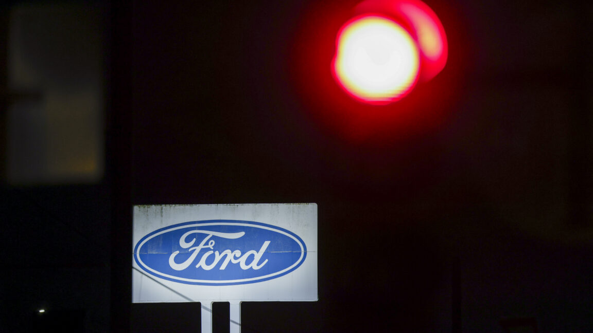 08 December 2025, North Rhine-Westphalia, Cologne: A logo of the car manufacturer Ford can be seen on a large sign of the Ford plant in Cologne. Photo: Thomas Banneyer/dpa (Photo by Thomas Banneyer/picture alliance via Getty Images)