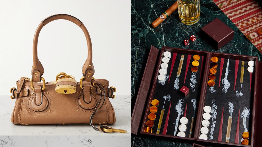 a chloe paddington bag in tan, resting on a marbled surface; a luxury backgammon set laid out next to a cigar, dice, and a drink